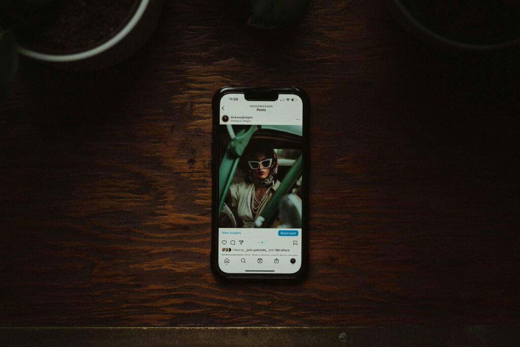Phone displaying an Instagram account on the screen.